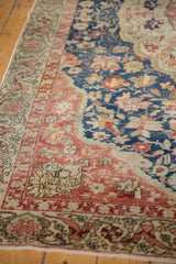 Textured navy, red, and ivory floral motifs on the distressed vintage Sivas rug border.