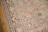 Distressed vintage Oushak pile with even wear, in pale blush, ivory, and brown.