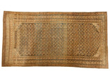 Antique Caucasian hand-knotted carpet, abashed dusty gold and faded navy geometric starbursts, circa 1910.