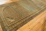 Antique Caucasian carpet, allover repeating starburst design with abrash, detailed geometric borders in navy and gold.