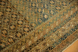 Antique Caucasian carpet featuring a geometric starburst field and intricate abraded borders.