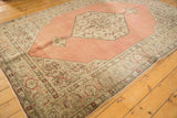 Distressed Tabriz carpet corner, dusty blush rose field, antique ivory Samovar border.