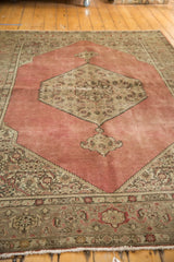 Distressed vintage Tabriz carpet border featuring Samovar Turtle design and Herati vines.