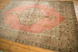 Distressed Tabriz carpet corner; dusty blush rose field and oxidized silver Herati spandrel.
