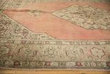 Distressed Tabriz carpet's Samovar border, Herati vines, and stepped blush rose field.