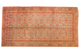 Distressed vintage Khotan runner, faded germinating pomegranate motif on pale sea foam green.