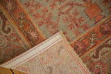 Vintage distressed Khotan rug with hand-knotted backing, secured edge, and even pile wear.