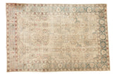 1930s distressed Persian Tabriz carpet with ivory, aqua, and blush floral medallions.