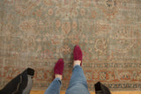 Vintage Distressed Sivas carpet with muted sea foam green, terracotta, and blush oversized floral patterns.