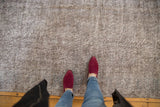 Distressed hand-knotted Turkish Sparta rug with subtle floral patterns in oxidized silver and slate blue.