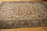 Scalloped scrolling leaves and Samovar turtle motif on a distressed vintage Mehrivan rug.