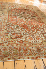 Distressed vintage Mehrivan rug's geometric border detail in terracotta, ivory, and soft blue.