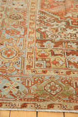 Distressed Mehrivan rug, low pile detail with geometric serrated leaves, terracotta and muted blue-green.