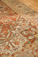 Distressed Mehrivan carpet's low pile, geometric serrated leaves in terracotta, ivory, and soft silver.