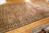 Distressed Mahal carpet corner, with wide banded border and oversized chestnut, terracotta elements.