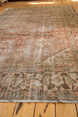 Distressed fringe and chestnut brown border of the vintage Mahal carpet, showing isolated wear.