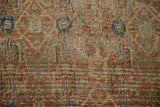 Antique Shiraz rug detail showing knot heads and visible foundation with muted copper tones.