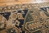 Antique Northwest Persian runner: geometric navy, mallard green, sand patterns, showing exposed wear.