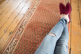 Vintage Mir Serbend runner with brick red field, repeating boteh, and ivory border.