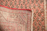 Hand-knotted foundation, red overcasting, and brick red patterned pile of a Mir Serbend runner.