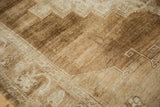 Distressed vintage Oushak carpet with heavily abrashed low pile and geometric details.