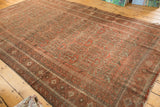 Vintage Belouch carpet showing intricate geometric field and detailed multi-stripe borders.