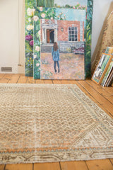 Distressed vintage Mir Serbend rug, showing worn texture and allover boteh with faint foundation.