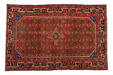 Vintage Malayer rug, cherry red field with allover Herati motif, central diamond medallion, and navy borders.