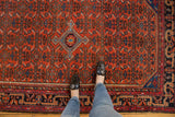 Cherry red vintage Malayer rug with Herati motif, sky blue diamond medallion, low pile.