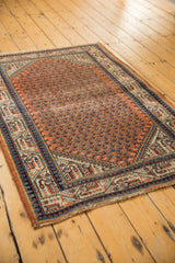 Vintage Mir Serbend rug: geometric pawn, vine borders, terracotta field, faint foundation.