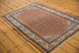 Vintage Mir Serbend rug corner, burnt orange field, navy boteh, geometric vine and pawn borders.