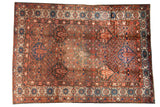 Vintage Persian Baktiari carpet, four seasons motif, madder red, cobalt blue, and patina.