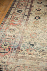 Detailed view of the distressed texture and worn knot heads on a vintage Veramin carpet.