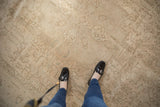 Distressed vintage Sivas carpet showing faded ivory floral motifs and even wear.