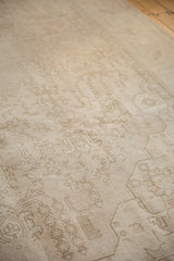 Vintage distressed Sivas carpet showing even wear across knot heads and faded floral motifs.