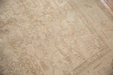 Distressed vintage Sivas carpet showing faded floral motifs and faint foundation through even wear.