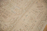 Faded floral motifs on distressed Sivas rug, showing low pile and exposed foundation.