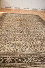 Distressed vintage Malayer carpet's Herati field and brown border with aqua accents.