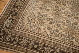Vintage Distressed Malayer rug: chocolate brown geometric borders, Herati motif, even wear.
