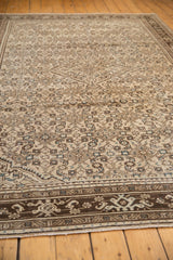 Distressed vintage Malayer carpet with even wear, Herati motif, and dark patterned border.