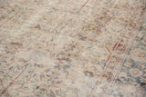 Distressed vintage Turkish Sparta carpet pile with faded ivory, blue, and blush palmette motifs.