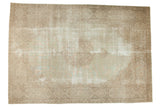 Distressed Persian Tabriz carpet with faded roundel medallion and ornate vinery, 9' x 12'9