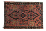 Antique Persian Lilihan rug: central medallion, prancing manticores, and scrolling floral vines on dusty raspberry.