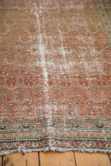 Worn pile texture of a vintage Distressed Malayer rug with blush, dusty rose, and sand hues.