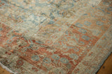 Distressed Lilihan carpet detail showing worn pile, exposed foundation, terra cotta, dusty teal floral.