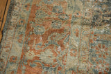 Distressed Lilihan carpet texture with exposed foundation, vibrant terra cotta, and dusty teal.
