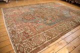 Distressed Karaja carpet with expressive geometric border, faded sky blue field accents, and visible textural wear.