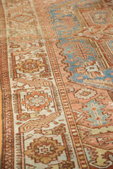 Distressed Persian Karaja carpet detail: expressive border, geometric florals, sky blue, rose, green.