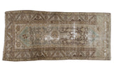 Distressed Hamadan runner with central medallion, geometric field, muted brown and sea foam green.