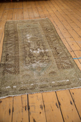 Distressed vintage Hamadan runner end, with faded green and bronze geometric pattern and secure fringe.